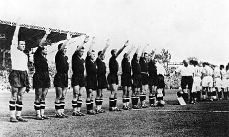 Italy's team perform the fascist salute in 1938